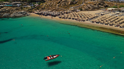 Aerial drone photo of iconic organised beach of Super Paradise with emerald clear sandy seascape,...