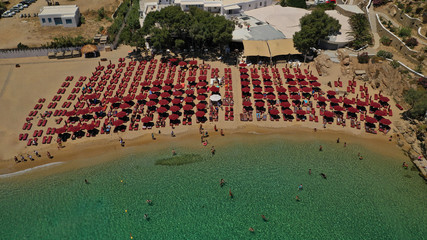 Naklejka premium Aerial drone photo of iconic organised beach of Super Paradise with emerald clear sandy seascape, Mykonos island, Cyclades, Greece