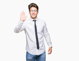 Young business man wearing glasses over isolated background Waiving saying hello happy and smiling, friendly welcome gesture