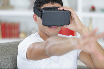 young handsome man in a virtual reality mask