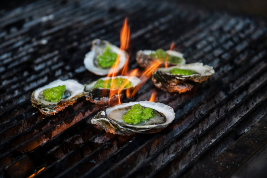 Oysters with herb butter on the grill
