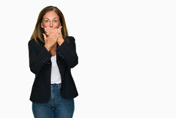 Beautiful middle age business adult woman over isolated background shocked covering mouth with hands for mistake. Secret concept.