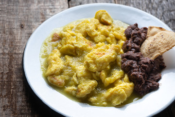 Mexican scrambled eggs in green sauce also called 