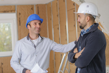 men inspecting the house