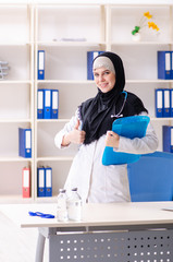 Young doctor in hijab working in the clinic 