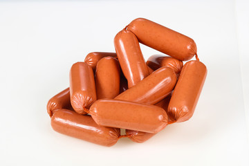 Tasty meat sausages over white background