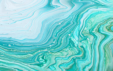 photography of abstract marbleized effect background. Blue, mint, gold and white creative colors....