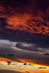 Dramatic Panoramic View of a cloudscape during a dark and colorful sunset. Taken over Beach Ancon in Trinidad, Cuba.