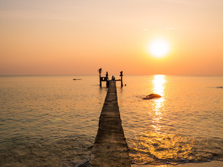Fototapeta premium People on the pier at sunset. In Phu Quoc island, Vietnam