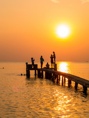 Fototapeta premium People on the pier at sunset. In Phu Quoc island, Vietnam