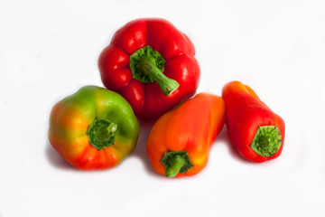 red and yellow peppers isolated on white background