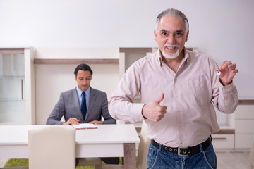 Male real estate agent and male client in the apartment 