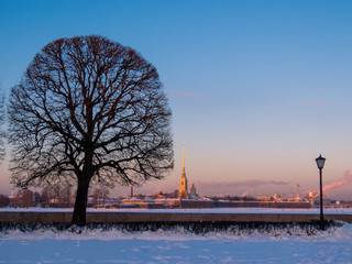 The frozen Neva River at sunset with the Peter and Paul Fortress in the background. St. Petersburg, Russia