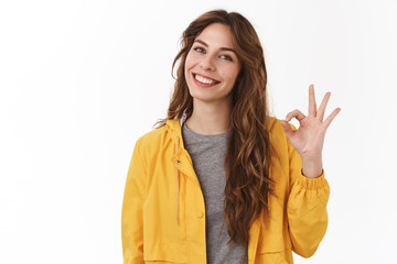 Good job. Pretty carefree modern stylish caucasian girl long chestnut hair show okay ok approval...