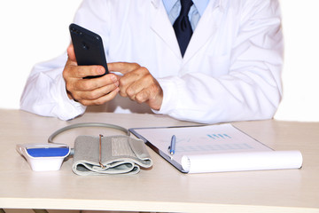Health - doctor measures blood pressure