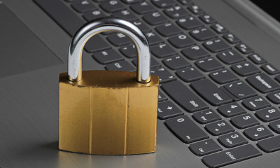 Computer protection concept, internet security. Lock on keyboard laptop