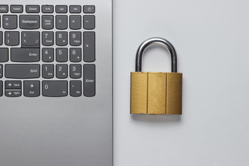 Computer protection concept, internet security. Lock on keyboard laptop
