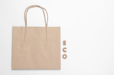 Ecological concept. Paper bag on white background with word eco. Top view