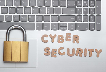 Cyber security. Lock on Laptop keyboard. Minimalistic concept. Top view