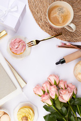 feminin beauty blogger flatlay topview with coffee cup cupcake basket background with copy space pink roses golden notebook lipstick eyeshadow cosmetics