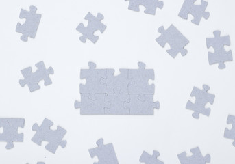 Many elements of a puzzle on a white background
