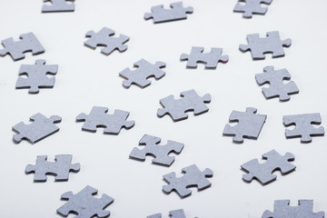 Naklejka premium Many particles of a puzzle on a white background