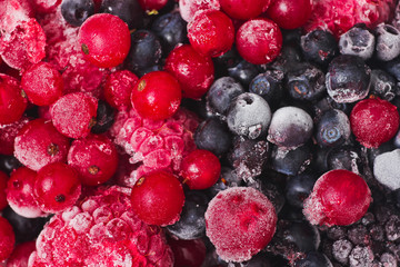 Frozen berries closeup. Cherries, currants, blueberries, blackberries