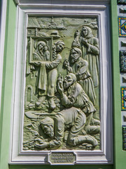 CHELYABINSK, RUSSIA - JUNE 5, 2018: Religious bas-relief on the exterior of the St. Simeon Cathedral. Russian text: "Acquisition of the Kazan Icon of the Mother of God in Kazan".