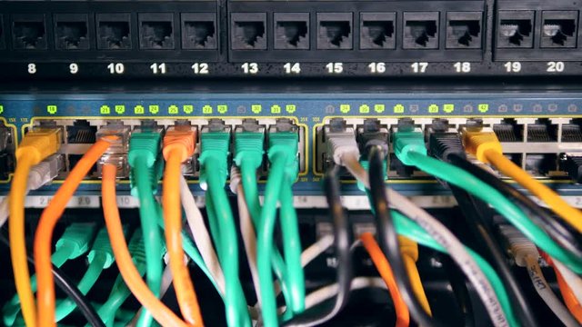 Many wires connected to a working computer.