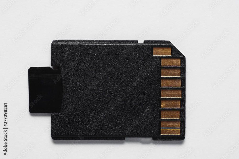 Poster micro sd memory card with adapter on white background close up