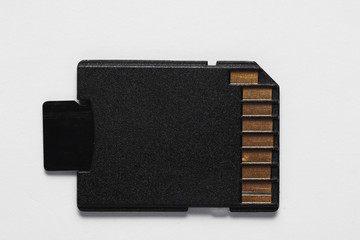 Micro SD memory card with adapter on white background close up