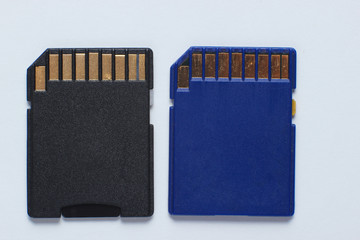 Two Mini SD memory cards on white background close up
