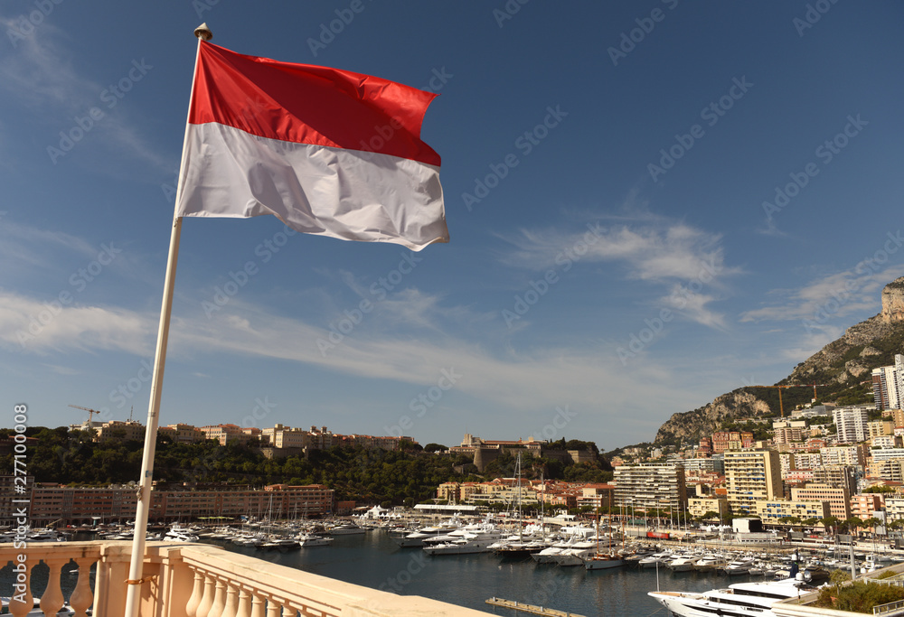 Wall mural flag of monaco waving at the centr of monaco.