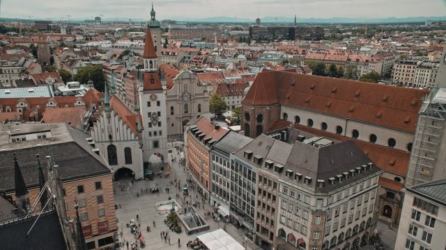 Timelapse aerial view of the Munich center crowded with people visiting Marienplatz, July 03, 2019 in Munich, Germany.
