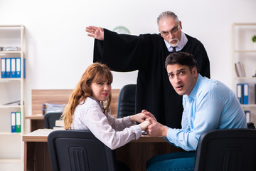 Young couple in the courthouse in divorce concept  
