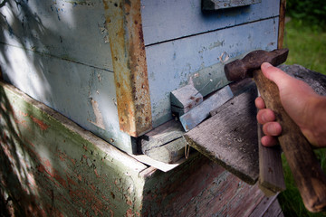 old wooden beehive repair