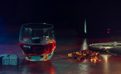 Glass of matured malt whisky with chilling cube