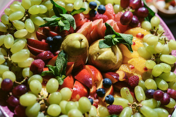 Buffet table. Fruits and berries rainbow top view. Natural vitamins and antioxidants food concept. Detox