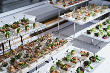Tray of snacks at a banquet or reception. Catering buffet at party. Buffet table welcome drink concept