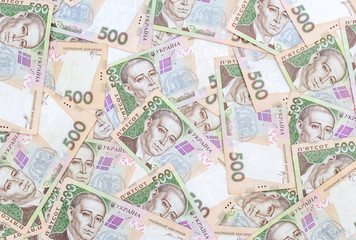 Financial background by 500 hryvnia bills. Top view.