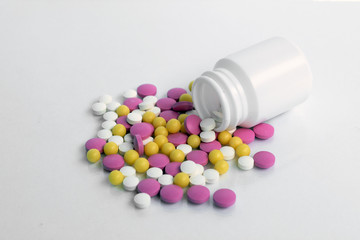 pills and bottle on white background