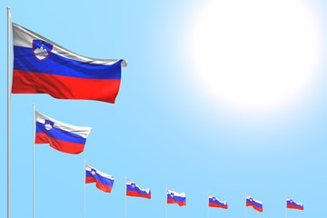 nice any occasion flag 3d illustration. - many Slovenia flags placed diagonal on blue sky with space for content