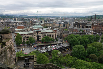 The cityscape of Edinburgh, Scotland, viewed southwest from Edinburgh Castle, is shown during a rainy day in 2019.
