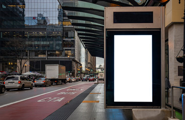 Blank billboard at bus stop for advertising, Chicago city buildings and street background