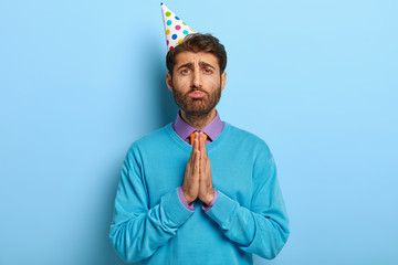 Sad pleading man feels sorry with girlfriend, organizes party to apologize, asks for something with...