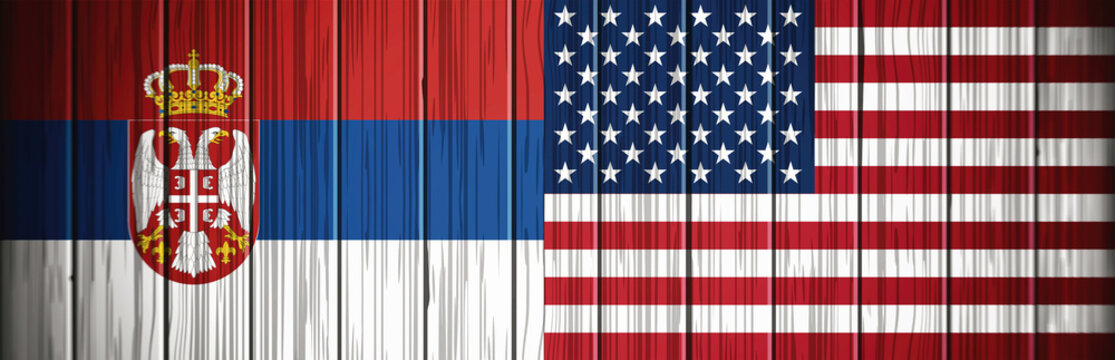 The flag of Serbia and the flag of America on a wooden background, web banner.