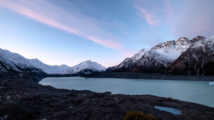 Fototapeta na wymiar Tasman glacier lake landscape in New Zealand. There are glacier, ice, icebergs, rocks and snow mountains in this wilderness area. This place is near Mount Cook.