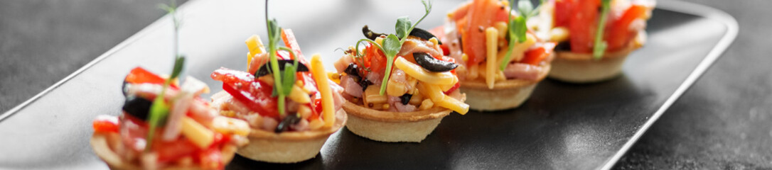 Delicious salad in tartlets. Concept of food, restaurant, cateri