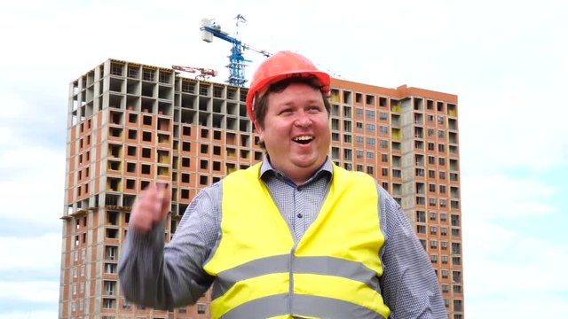 Happy builder worker or architect face expression. Wow, joyful man emotion on construction building site