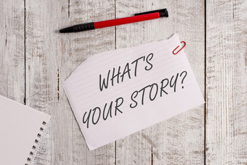 Word writing text What S Is Your Story question. Business photo showcasing analysisner of asking demonstrating about past life events Torn paper and notebook sheet with a pen placed on top of wooden